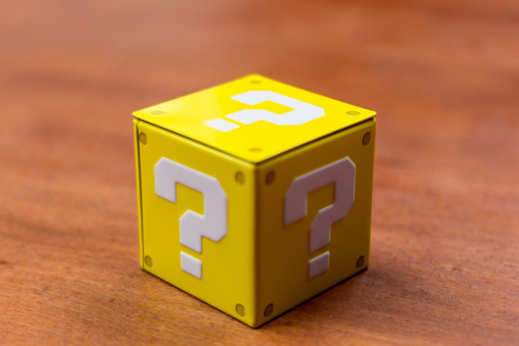 Yellow cube with question marks on each side