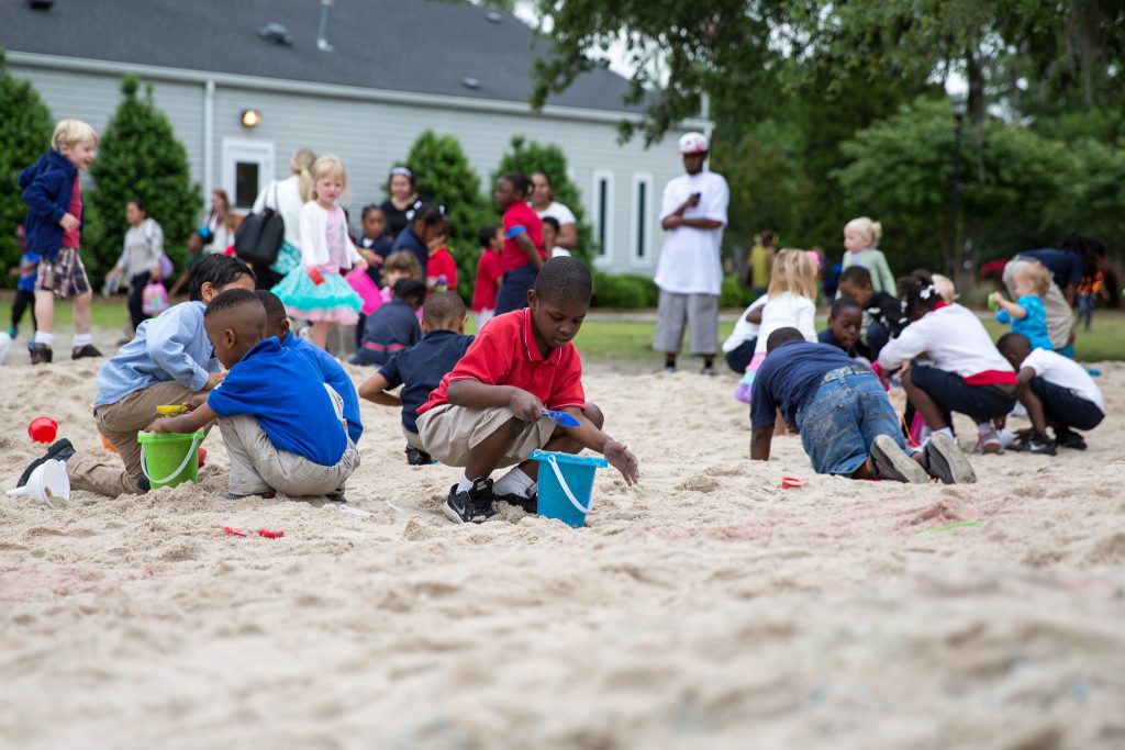 Children play in sandbox