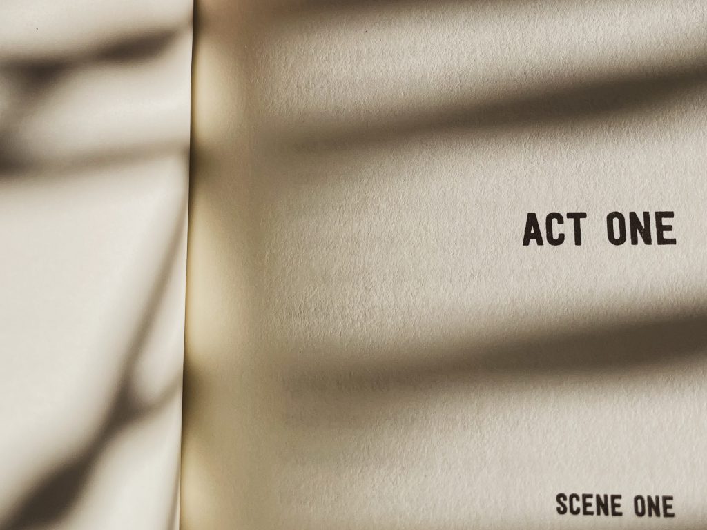 The front page of a script. Black text on a white page reads "ACT ONE. SCENE ONE" in all caps. 